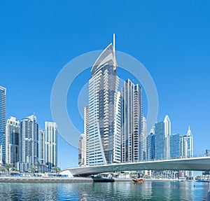 Dubai Marina and lake or river, Downtown skyline, United Arab Emirates or UAE. Financial district and business area in smart urban