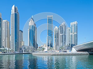 Dubai Marina and lake or river, Downtown skyline, United Arab Emirates or UAE. Financial district and business area in smart urban