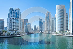 Dubai Marina and lake or river, Downtown skyline, United Arab Emirates or UAE. Financial district and business area in smart urban