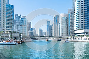 Dubai Marina and lake or river, Downtown skyline, United Arab Emirates or UAE. Financial district and business area in smart urban