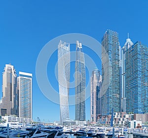 Dubai Marina and lake or river, Downtown skyline, United Arab Emirates or UAE. Financial district and business area in smart urban