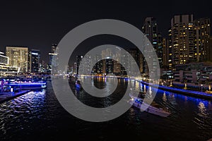 dubai marina night cruise. Luxury yachts in night lights on the water.