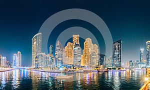 Dubai Marina Port, UAE, United Arab Emirates - May 19, 2021: Beautiful Night view of high-rise buildings of residential