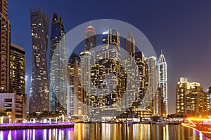 Dubai Marina skyline architecture buildings travel at night twilight in United Arab Emirates