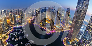 Dubai Marina skyline architecture buildings travel overview at night twilight from above panorama in United Arab Emirates