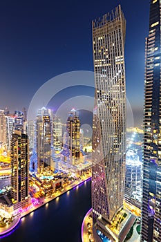 Dubai Marina skyline architecture buildings travel overview at night twilight from above portrait format in United Arab Emirates