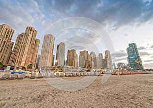 Dubai Marina skyline from the beach at sunset