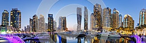 Dubai Marina skyline yacht harbor architecture travel at night twilight panorama in United Arab Emirates