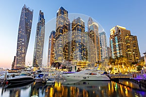 Dubai Marina skyline yacht harbor architecture travel at night twilight in United Arab Emirates