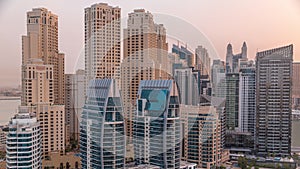 Dubai Marina skyscrapers and JBR district with luxury buildings and resorts aerial timelapse