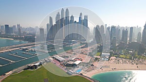 Dubai Marina skyscrapers and popular JBR beach in the UAE aerial view