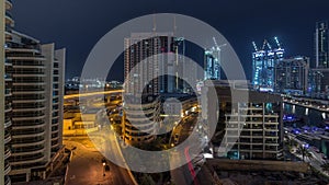 Dubai Marina skyscrapers and promenade aerial night to day timelapse, Dubai, United Arab Emirates