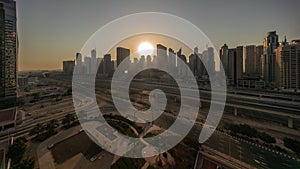 Dubai Marina skyscrapers and Sheikh Zayed road with metro railway aerial timelapse, United Arab Emirates