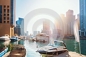 Dubai Marina with water pier and modern skyscrapers, United Arab Emirates