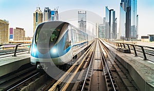 Dubai metro train on rails at background of skyscrapers. Famous outdoor subway Red Line