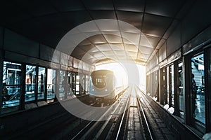 Dubai metro train on rails at subway platform station. Famous outdoor subway