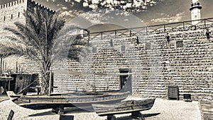 Dubai Museum with wooden boats on a beautiful sunny day, UAE