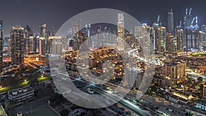 Dubai's business bay towers aerial night timelapse. Rooftop view of some skyscrapers