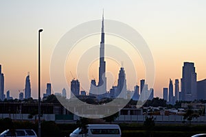 Dubai skyline with Burj Khalifa skyscraper at sunset, clear sky in United Arab Emirates