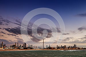 Dubai skyline at dusk seen from the Gulf Coast