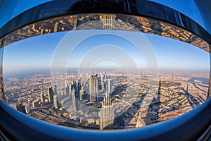 Dubai skyline with futuristic architecture by fisheye, United Arab Emirates