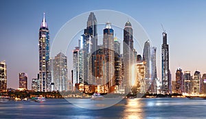 Dubai skyline Marina with reflecion at colorful sunset, UEA