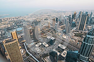 Dubai skyline panorama from above. Futuristic skyscrapers, office buildings and road junctions. Business district and