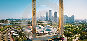 Dubai skyline seen through Dubai Frame building with Zabeel park and Dubai skyline aerial view