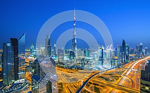 Dubai skyline at sunset with beautiful city center lights and Sheikh Zayed road traffic,Dubai,United Arab Emirates