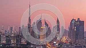 Dubai skyline after sunset with beautiful city center lights and Sheikh Zayed road traffic timelapse, Dubai, United Arab