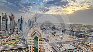 Dubai skyline timelapse at sunset with beautiful city center skyscrapers and Sheikh Zayed road traffic, Dubai, United