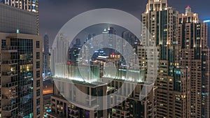 Dubai skyscrapers with illumination in business bay district night timelapse.