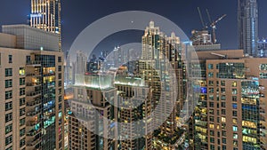 Dubai skyscrapers with illumination in business bay district night timelapse.