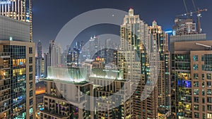 Dubai skyscrapers with illumination in business bay district night timelapse.