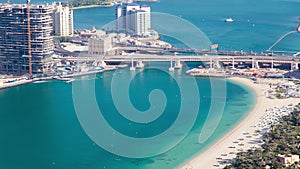 Dubai summer beach aerial time lapse. pan up