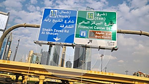 Dubai traffic signs over the road. United Arab Emirates. photo