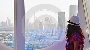 Dubai, UAE - 14th october, 2022: caucasian tourist in famous Frame landmark enjoy panorama of city skyline. Visit UAE holiday