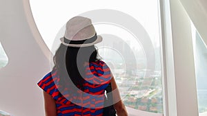 Dubai, UAE - 14th october, 2022: caucasian tourist in famous Frame landmark enjoy panorama of city skyline. Visit UAE holiday
