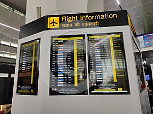 Flight information displayed on the vertical led monitor at the international airport for flights from different destinations.