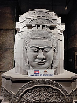 Large head sculpture of the Khmer Buddha created from grey rock. Angkor wat temple is an ancient world civilization located in Cam