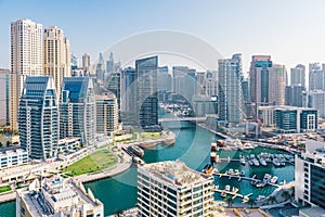 Dubai, UAE. Beautiful aerial top view Dubai Marina promenade and canal with floating yachts and boats