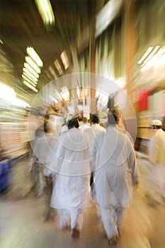 Dubai UAE The Bur Dubai souq is crowded with pedestrians just after dark. photo