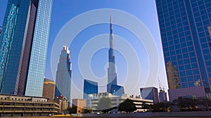 DUBAI, UAE - Burj Khalifa the tallest building in the world. Dubai Downtown cityscape. Dubai evening skyline, busy roads, sunset o