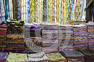Dubai UAE Colorful fabrics are displayed for sale at the Al Naif souq in Deira. photo