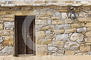 Dubai UAE Detail of stone huts on display at Heritage Village in Bur Dubai