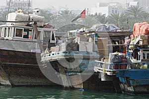 Dubai UAE Dhows old wooden sailing vessels are docked along the Deira side of Dubai Creek.