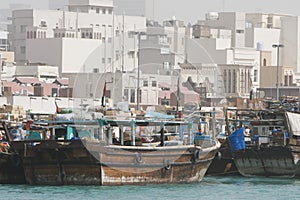 Dubai UAE Dhows old wooden sailing vessels are docked along the Deira side of Dubai Creek.