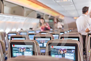 05.03.2018 - Dubai UAE: Emirates interior of airplane with passengers on seats waiting to taik off.