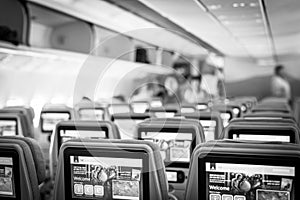 05.03.2018 - Dubai UAE: Emirates interior of airplane with passengers on seats waiting to taik off.