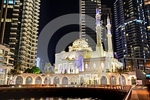 The night illumination of Dubai Marina and Muslim Mosque